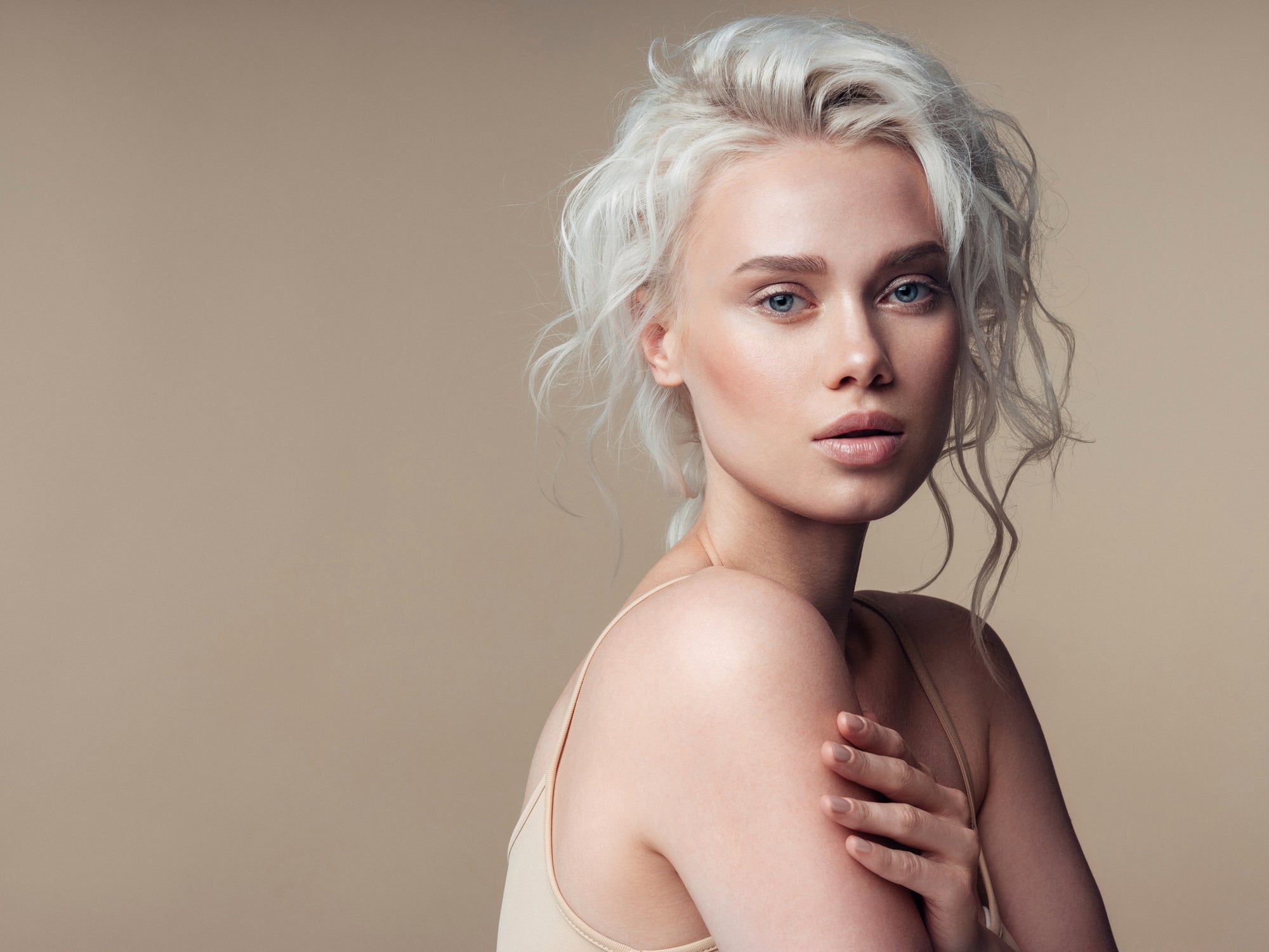 Model with platinum blonde styled hair